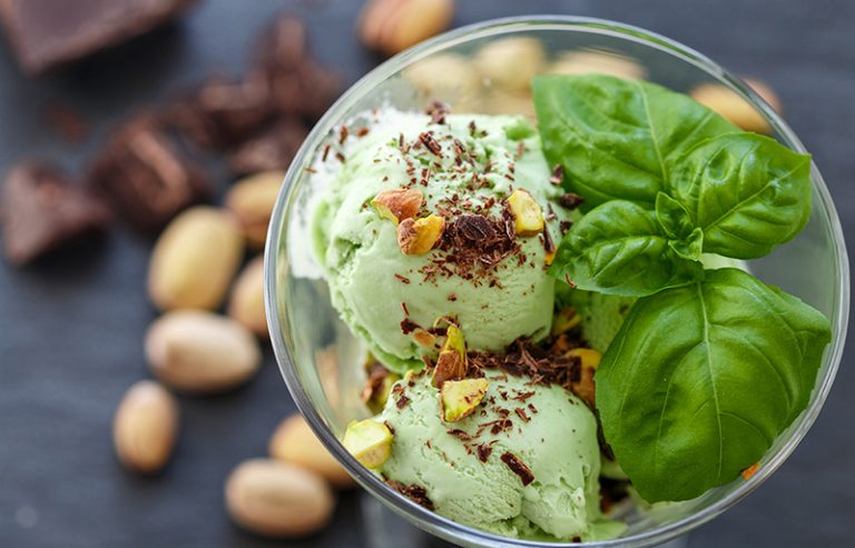 Homemade organic green ice cream - Basil, pistachio, green tea, mint. A refreshing summer dessert. Selective focus